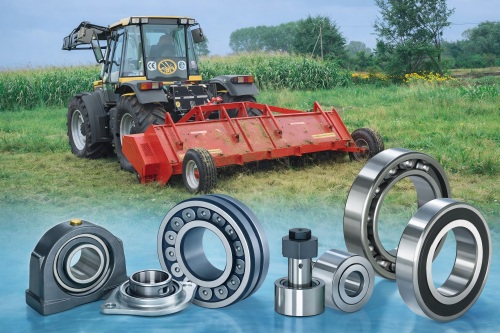 Red mower in a lush field, foreground showing mounted, deep groove ball, and roller bearings, highlighting agricultural machinery applications, realistic, high-detail, horizontal composition